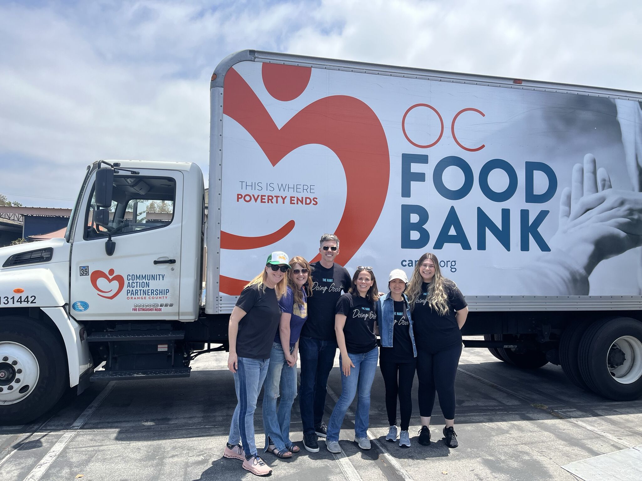 Workers outside an OC Food Bank Truck