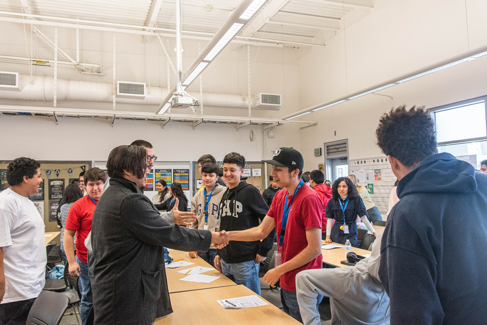 Students greeting each other at Force in Training Day