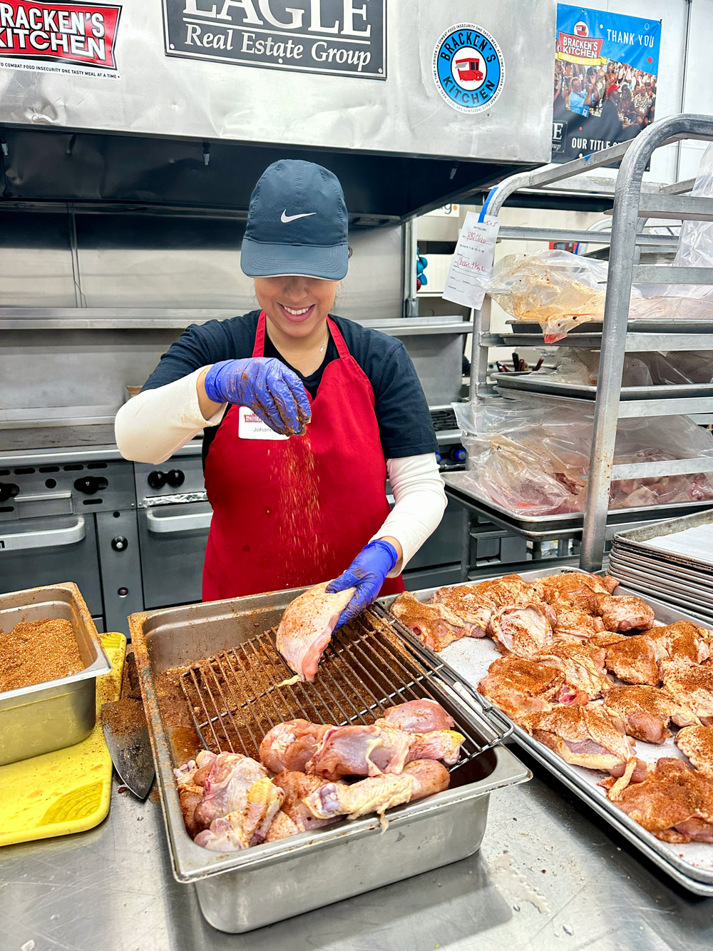 A Habit team member preparing chicken at Bracken's Kitchen