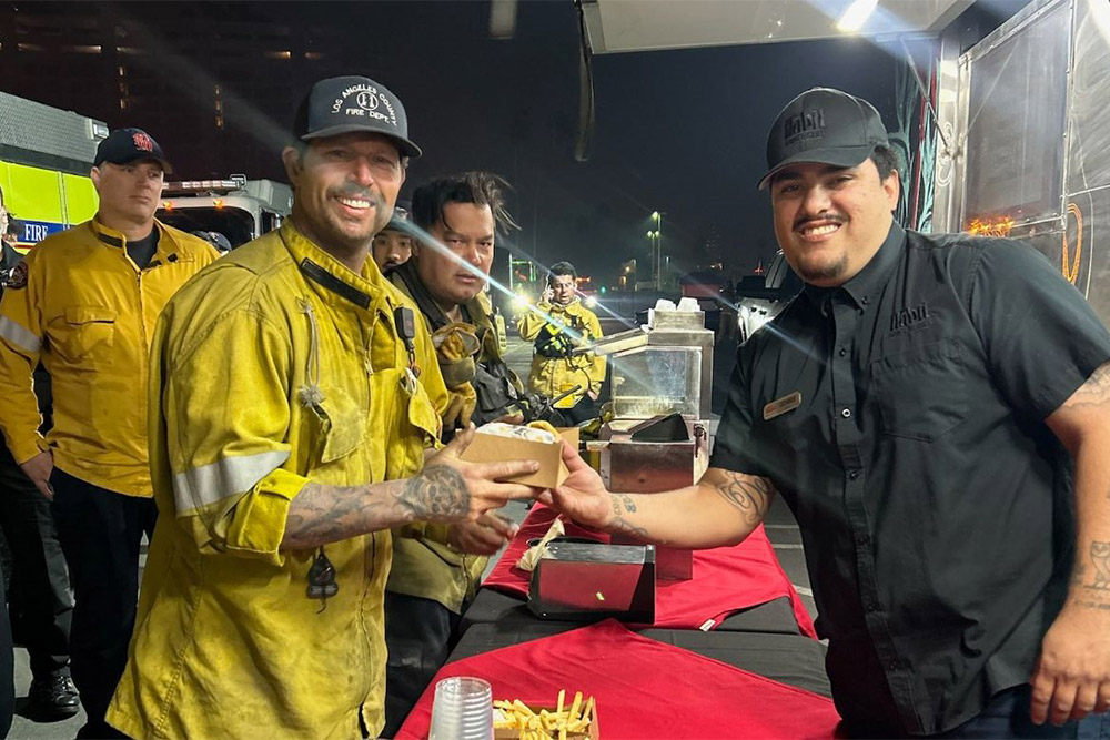 A Habit team member with firefighter